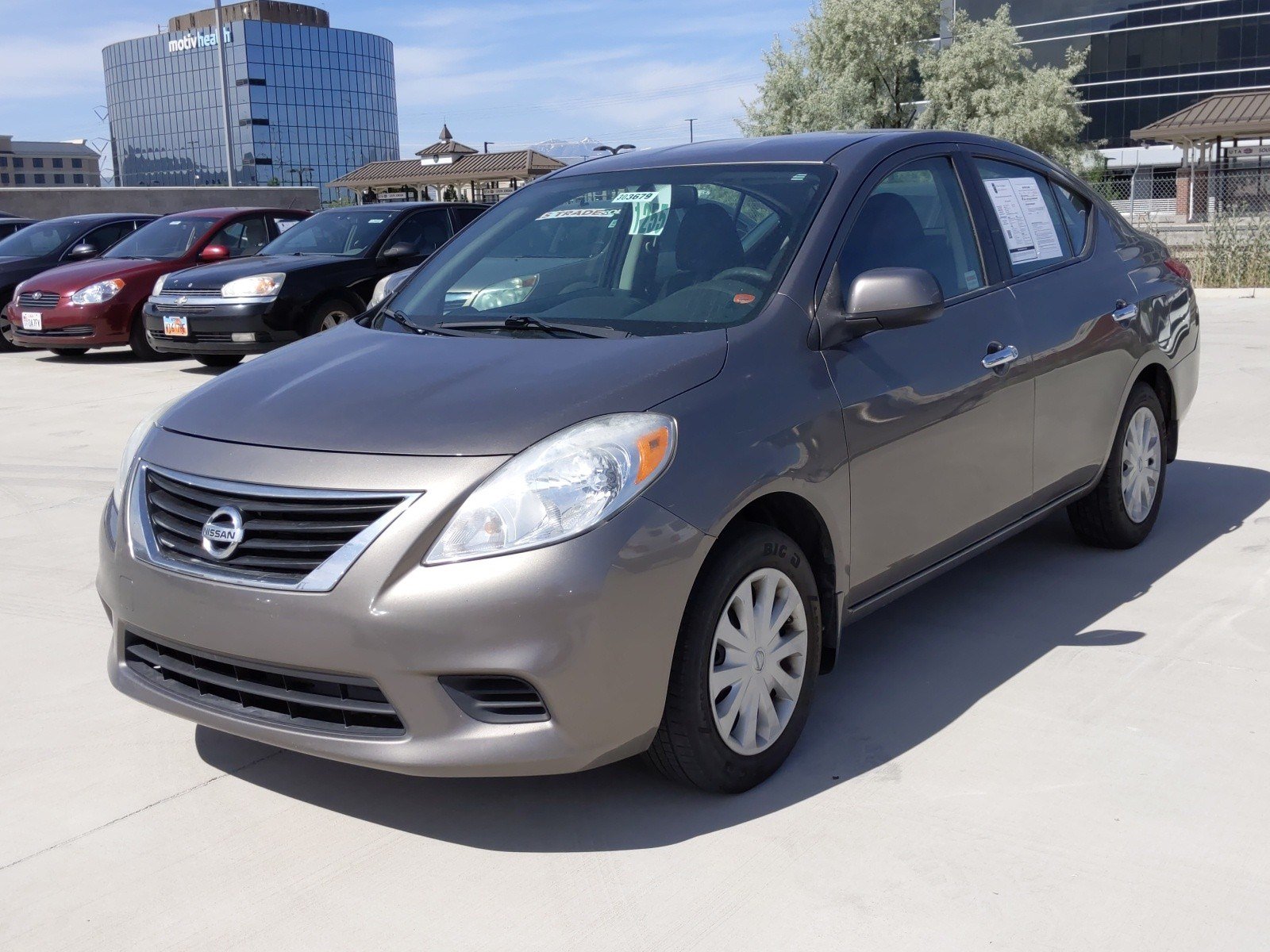 Pre-Owned 2012 Nissan Versa SV FWD 4dr Car